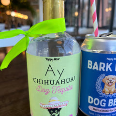 Dog-safe "Ay Chihuahua Day Tequila" and "Bark Brew Dog Beer" from Yappy Hour collection, displayed on table.