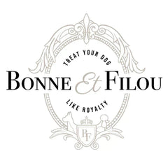 Elegant logo of Bonne et Filou featuring ornate crest, "Treat Your Dog Like Royalty" motto, symbolizing luxury pet treats.