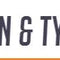 Logo of Dean & Tyler featuring stylish typography in orange and grey colors