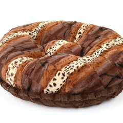 Plush leopard print bagel bed from HT Animal Supply, ideal for cozy pet sleep, blending luxury pet accessories with home décor.