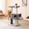 Three cats enjoying a multi-level cat tree with scratchers, cozy condos, and perches, showcasing premium pet products.